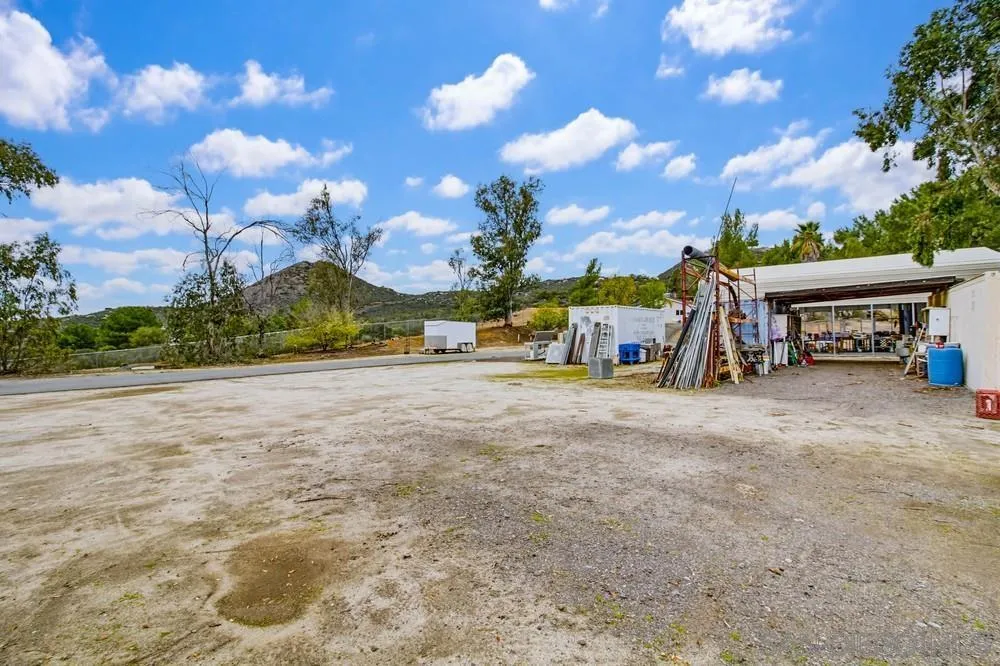 1478 Peutz Valley Road Alpine, CA 91901 - Photo 35 of 63 a view of a house with outdoor space and a car park in front of the house