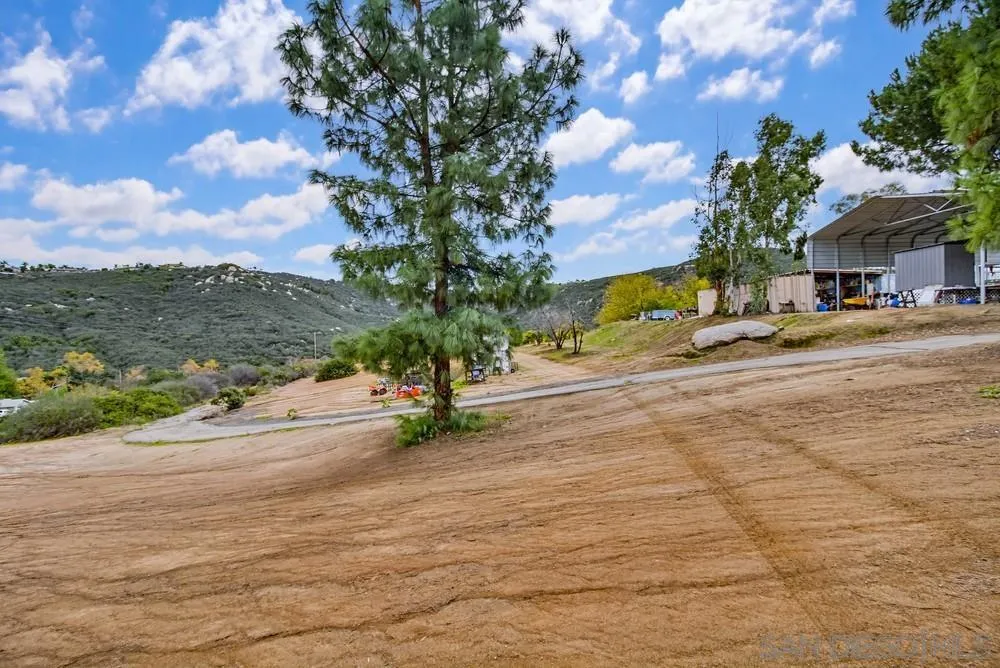 1478 Peutz Valley Road Alpine, CA 91901 - Photo 45 of 63 a view of a house with a yard