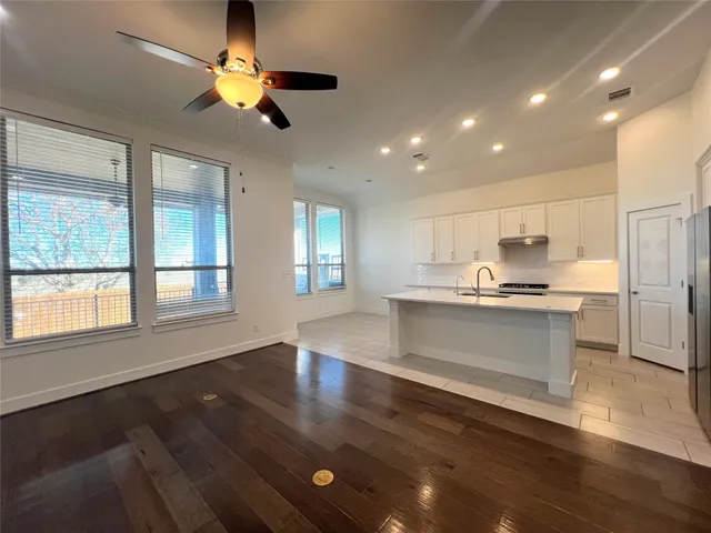 a view of a kitchen with a sink and an oven