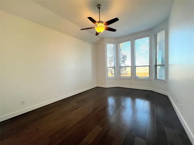 a large kitchen with stainless steel appliances granite countertop a large counter top a stove a sink and a refrigerator