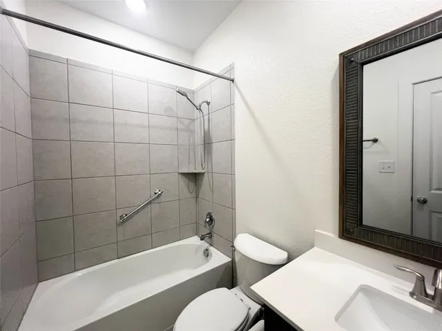 a bathroom with a sink and toilet