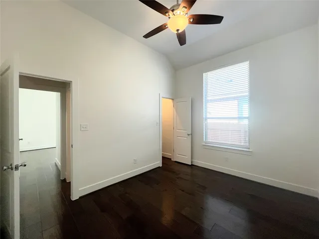 a large kitchen with stainless steel appliances kitchen island a stove a refrigerator a oven a sink with a island and chairs