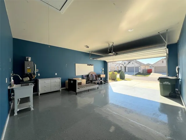a living room with furniture and a ceiling fan