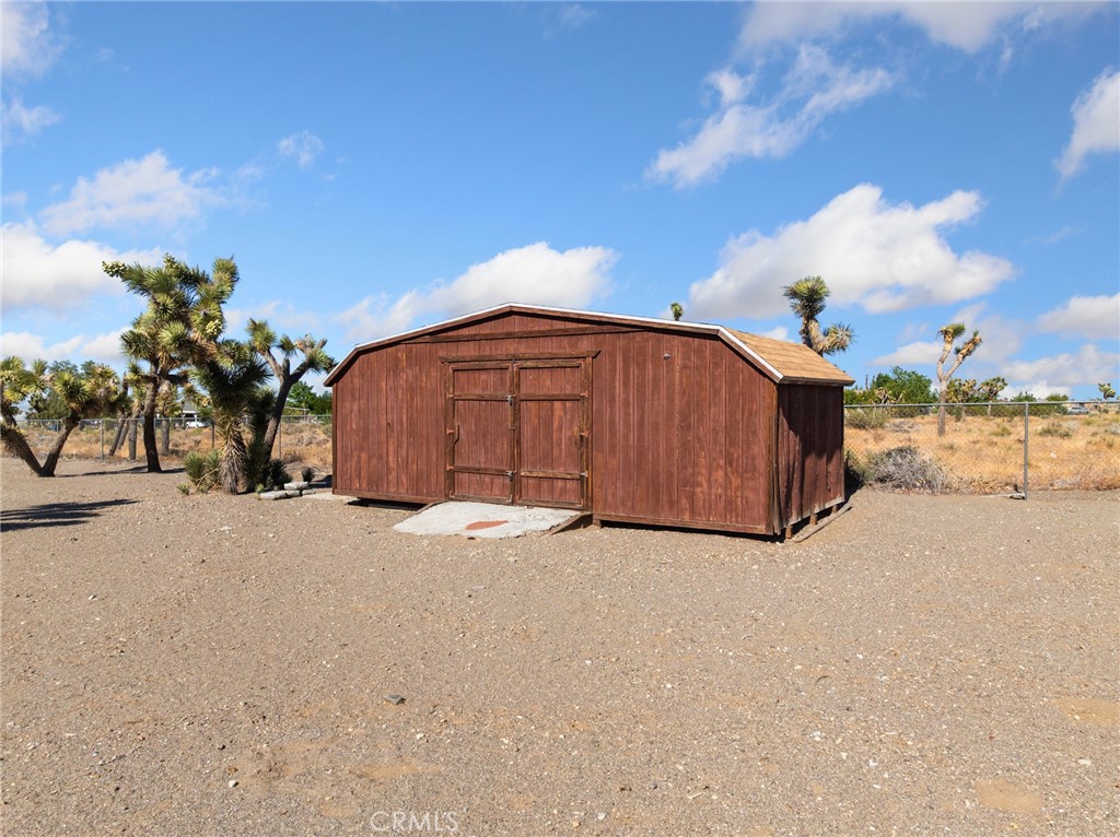 11025 El Esteban Road Phelan, CA 92371 - Photo 48 of 54 a view of a house with a yard