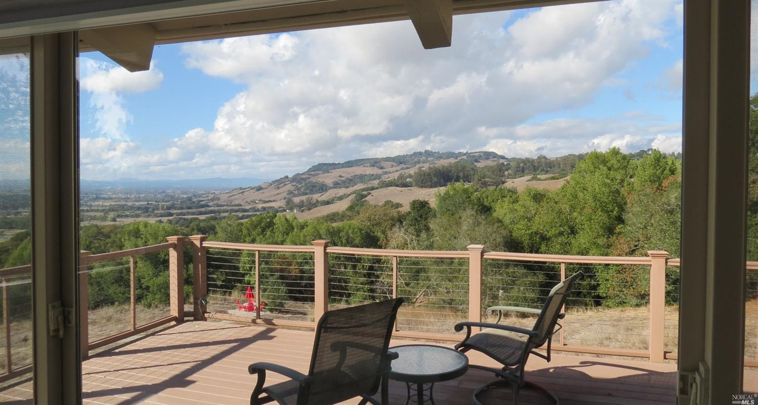 5009 Pressley Road Santa Rosa, CA 95404 - Photo 1 of 1 a view of a balcony with chair and wooden floor