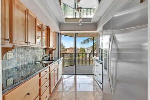 a spacious bathroom with a sink and a mirror