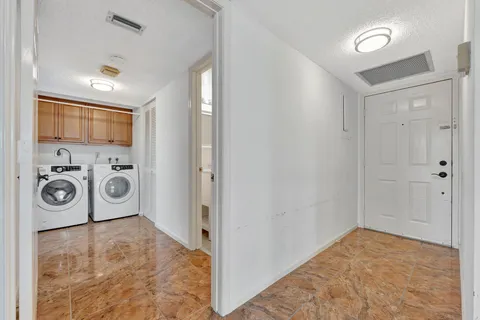 a view of hallway with a large window