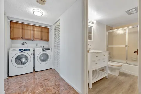 a view of a chairs and table in a backyard