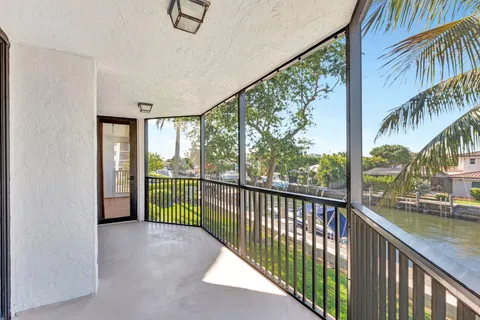 a view of a chairs and table in patio