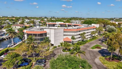 an aerial view of a house with garden space and street view