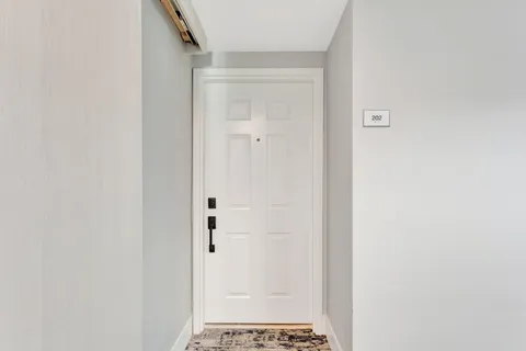 a view of a big room with windows and cabinet