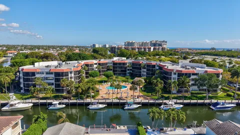 a living room with furniture cabinets and window