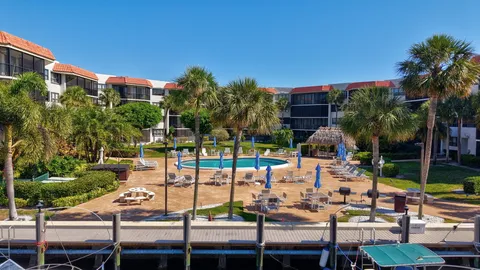 a view of a lake with houses in the back