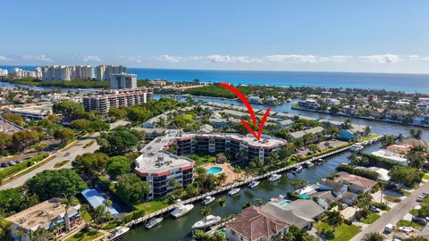 a room with pool table and windows