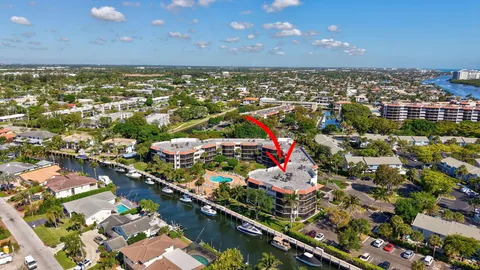 a living room with furniture gym equipment and a large window