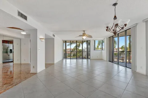 a kitchen with stainless steel appliances granite countertop a sink and a counter top space