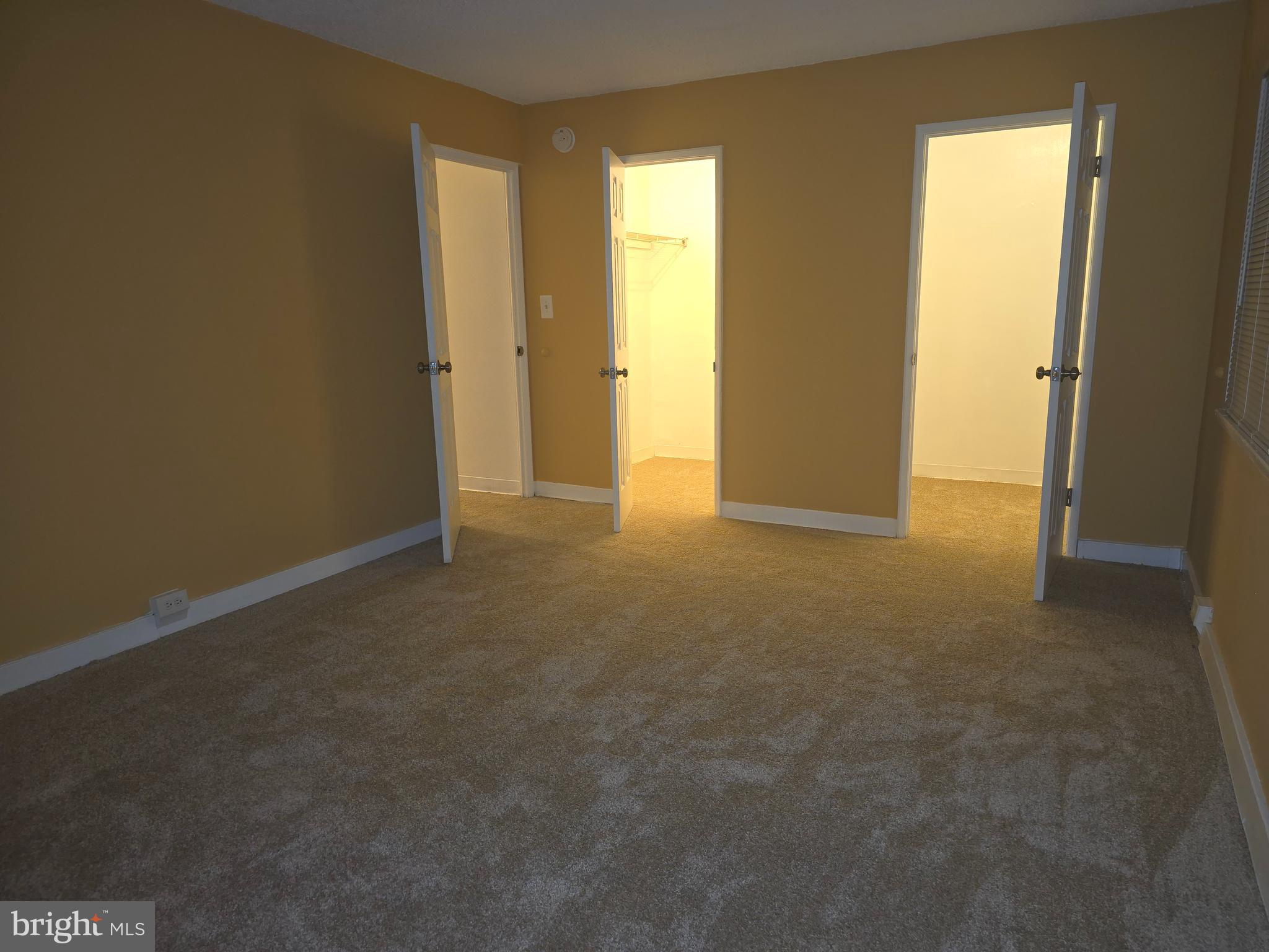 5901 Tamar Drive, Unit 10 S10 Columbia, MD 21045 - Photo 10 of 27 an empty room with windows