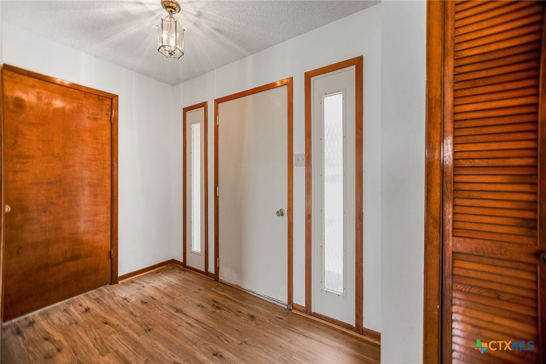 181 Pecan Street Port Lavaca, TX 77979 - Photo 8 of 34 a view of entryway with wooden floor
