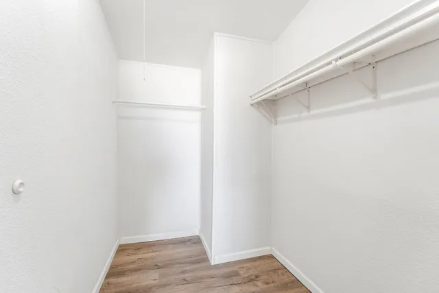a bathroom with a sink toilet vanity and shower