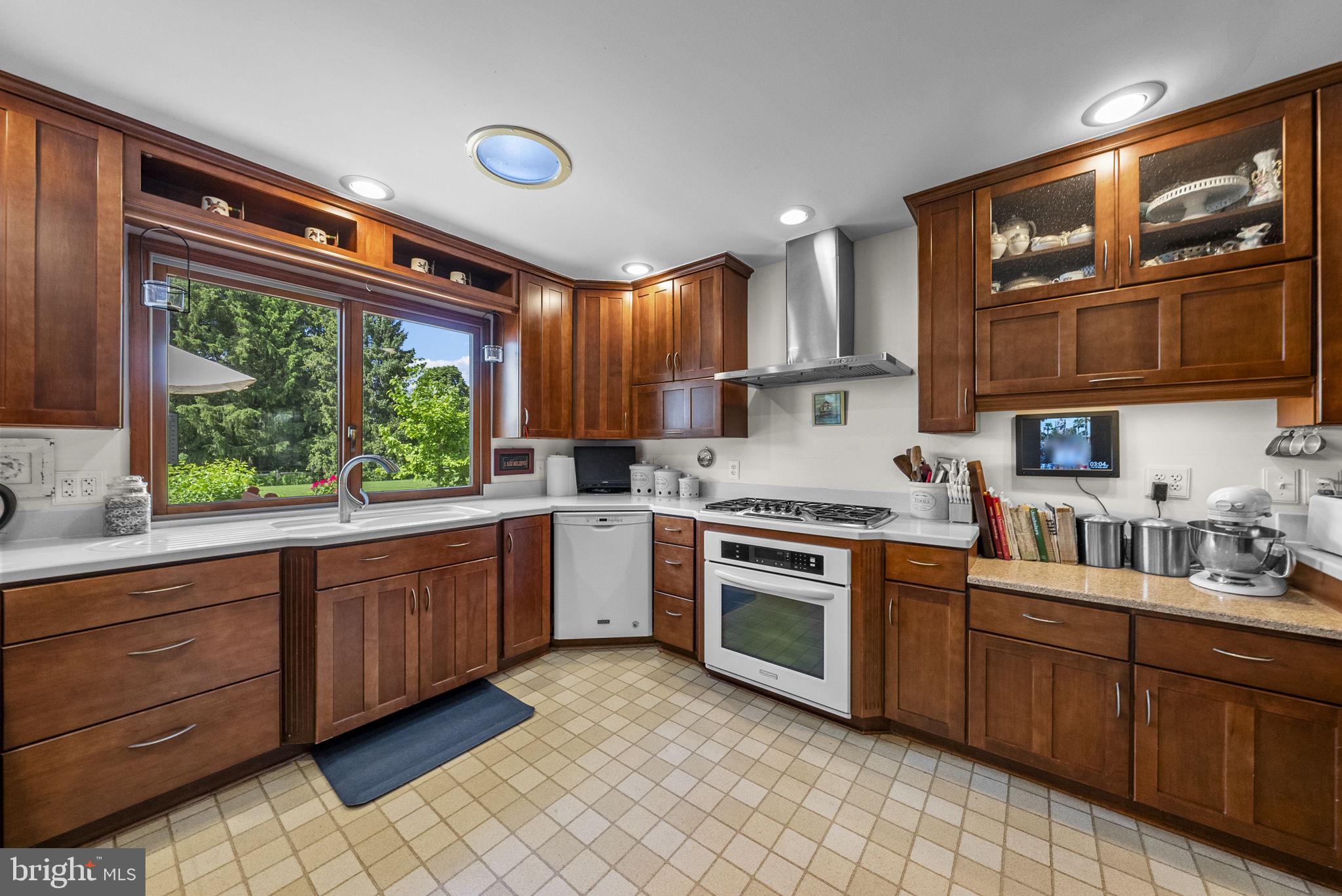 125 Mine Road Pennington, NJ 08534 - Photo 14 of 36 a kitchen with stainless steel appliances granite countertop a stove sink and cabinets