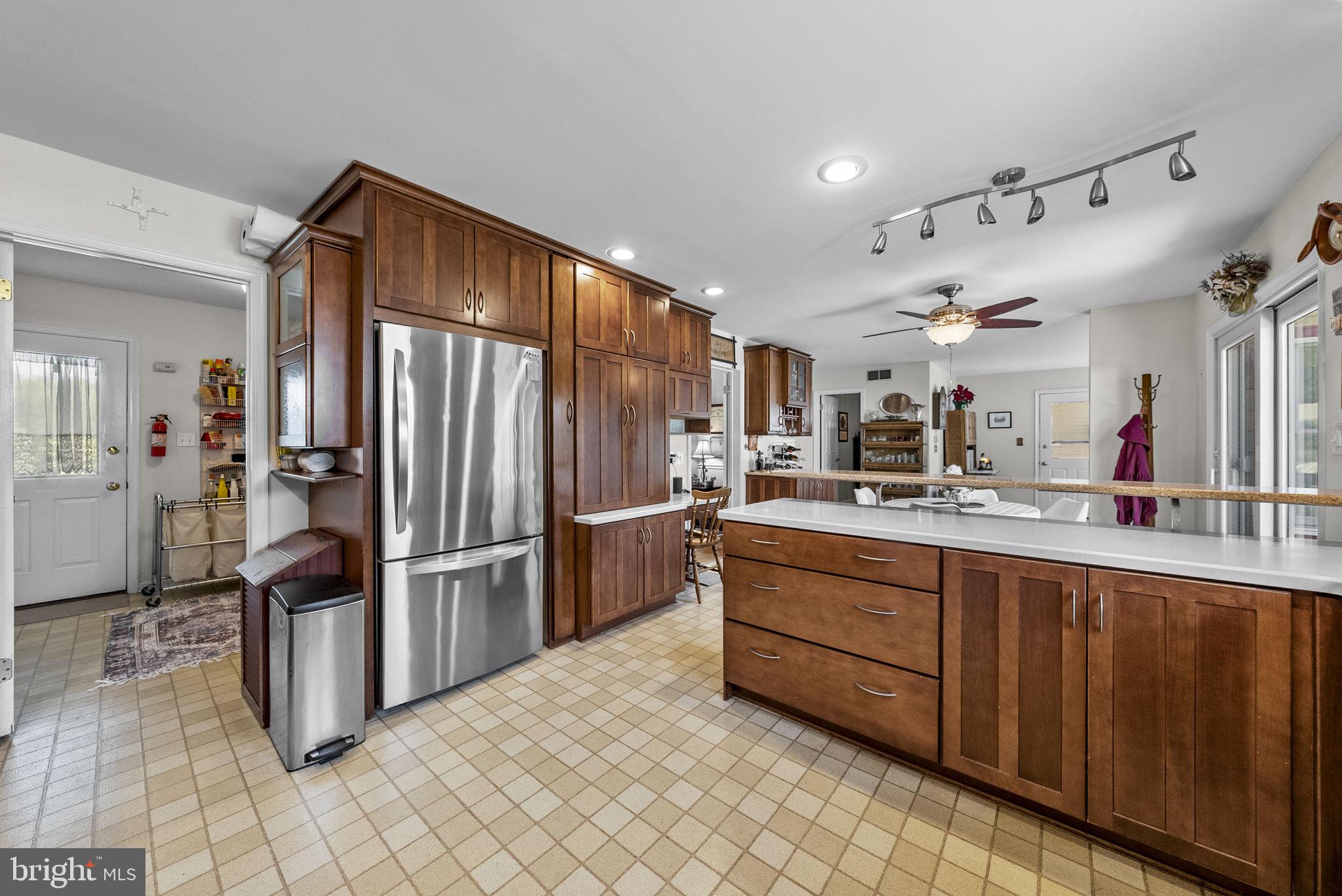125 Mine Road Pennington, NJ 08534 - Photo 15 of 36 a kitchen with stainless steel appliances kitchen island granite countertop a refrigerator and a sink