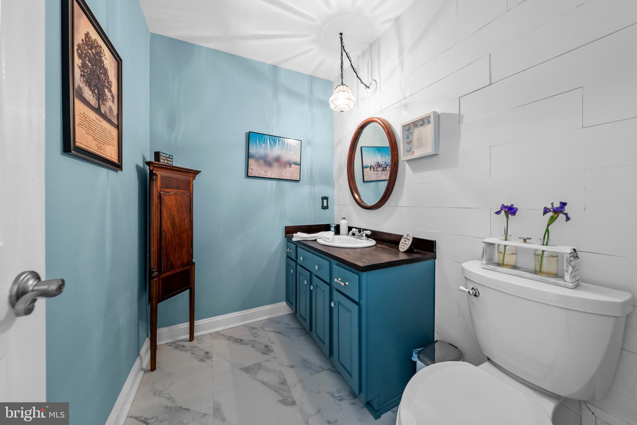 125 Mine Road Pennington, NJ 08534 - Photo 16 of 36 a bathroom with a toilet a sink and a mirror