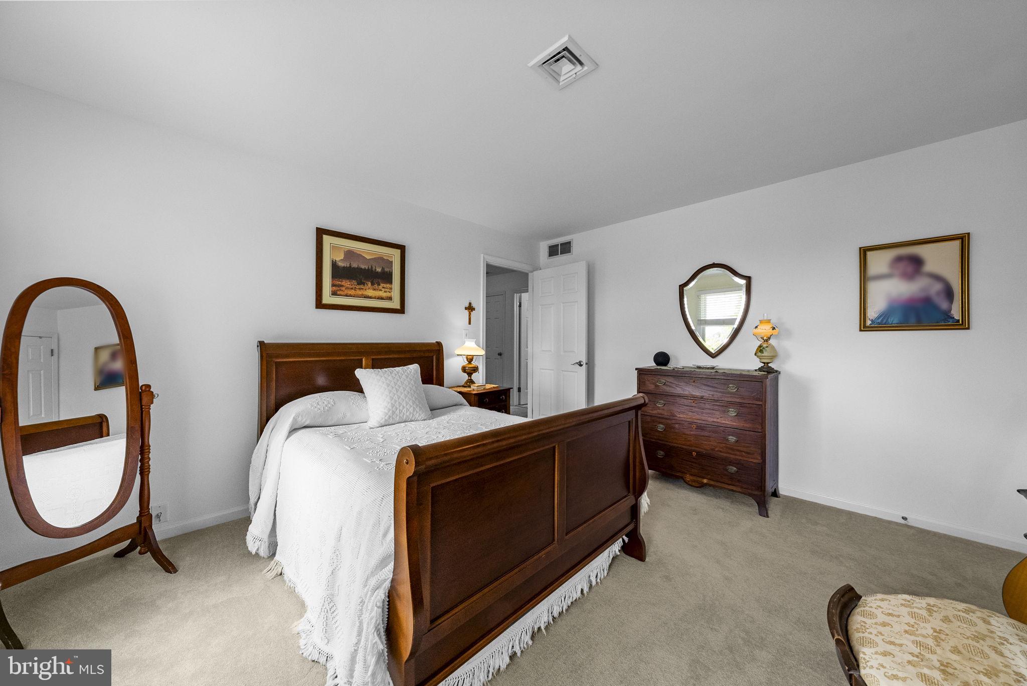 125 Mine Road Pennington, NJ 08534 - Photo 18 of 36 a bed room with a bed and mirror