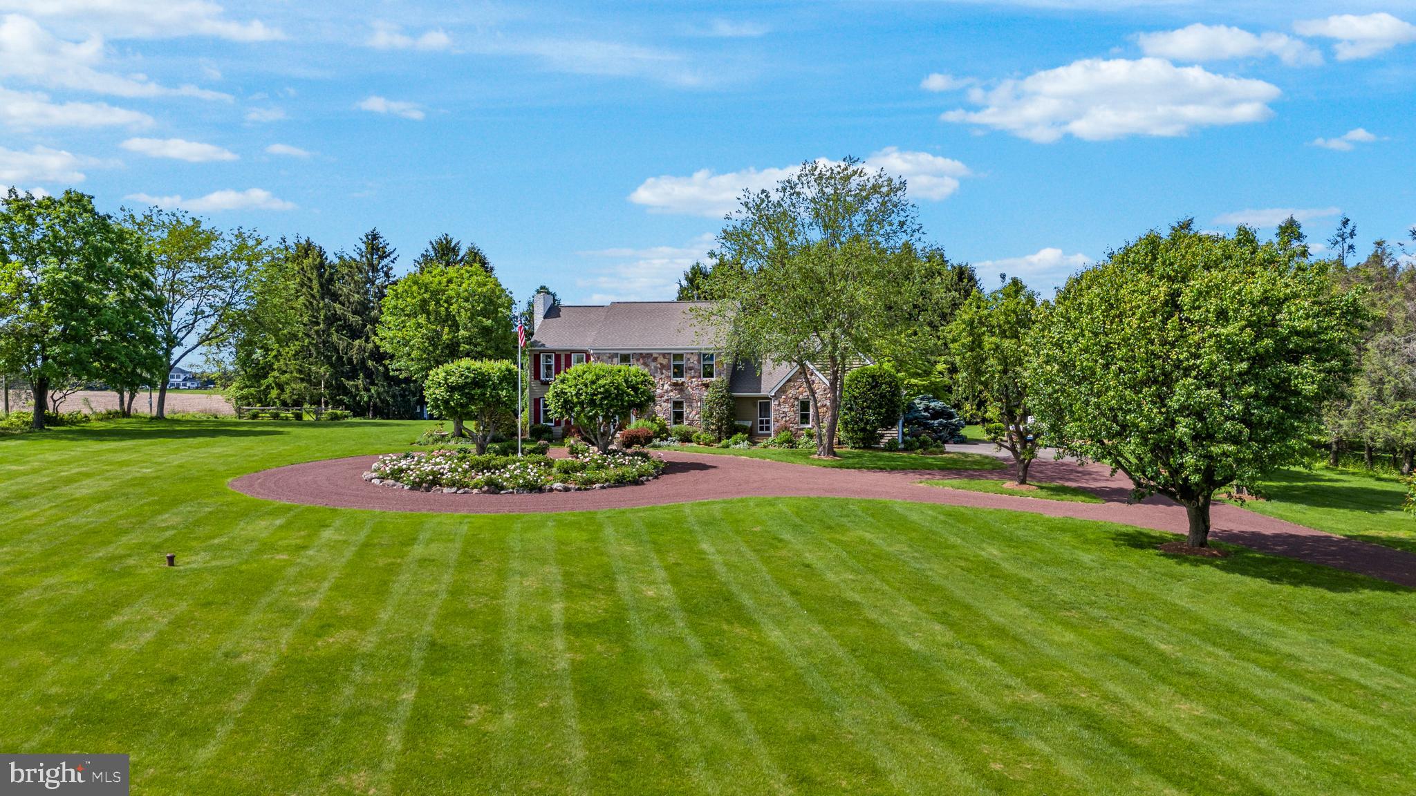 125 Mine Road Pennington, NJ 08534 - Photo 2 of 36 a view of a garden with houses in the background