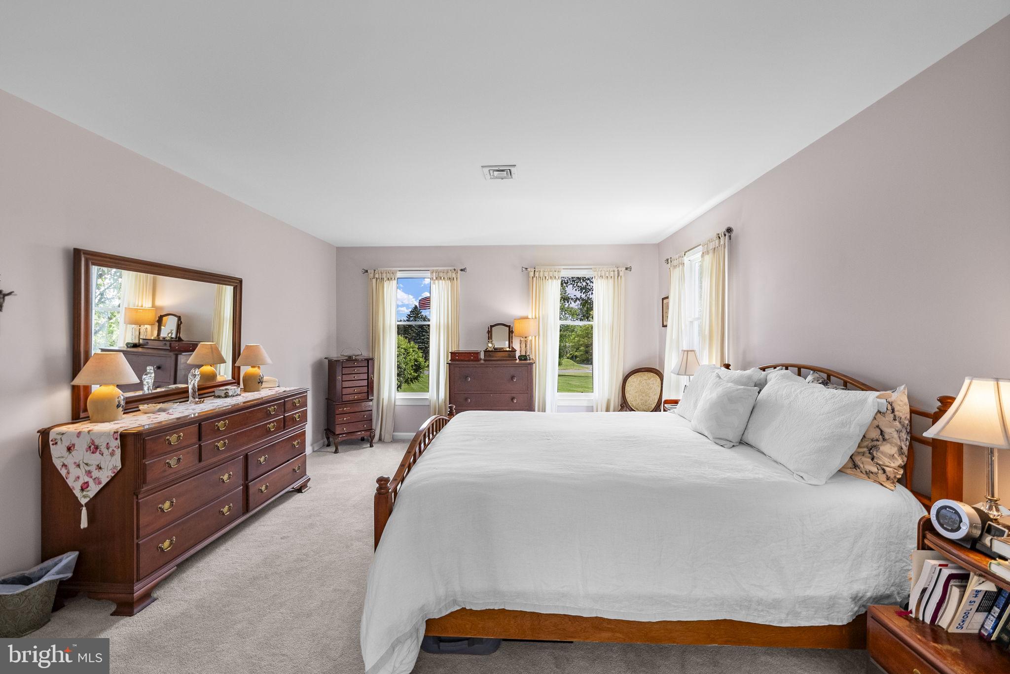 125 Mine Road Pennington, NJ 08534 - Photo 22 of 36 a large bedroom with a bed and a dresser in it