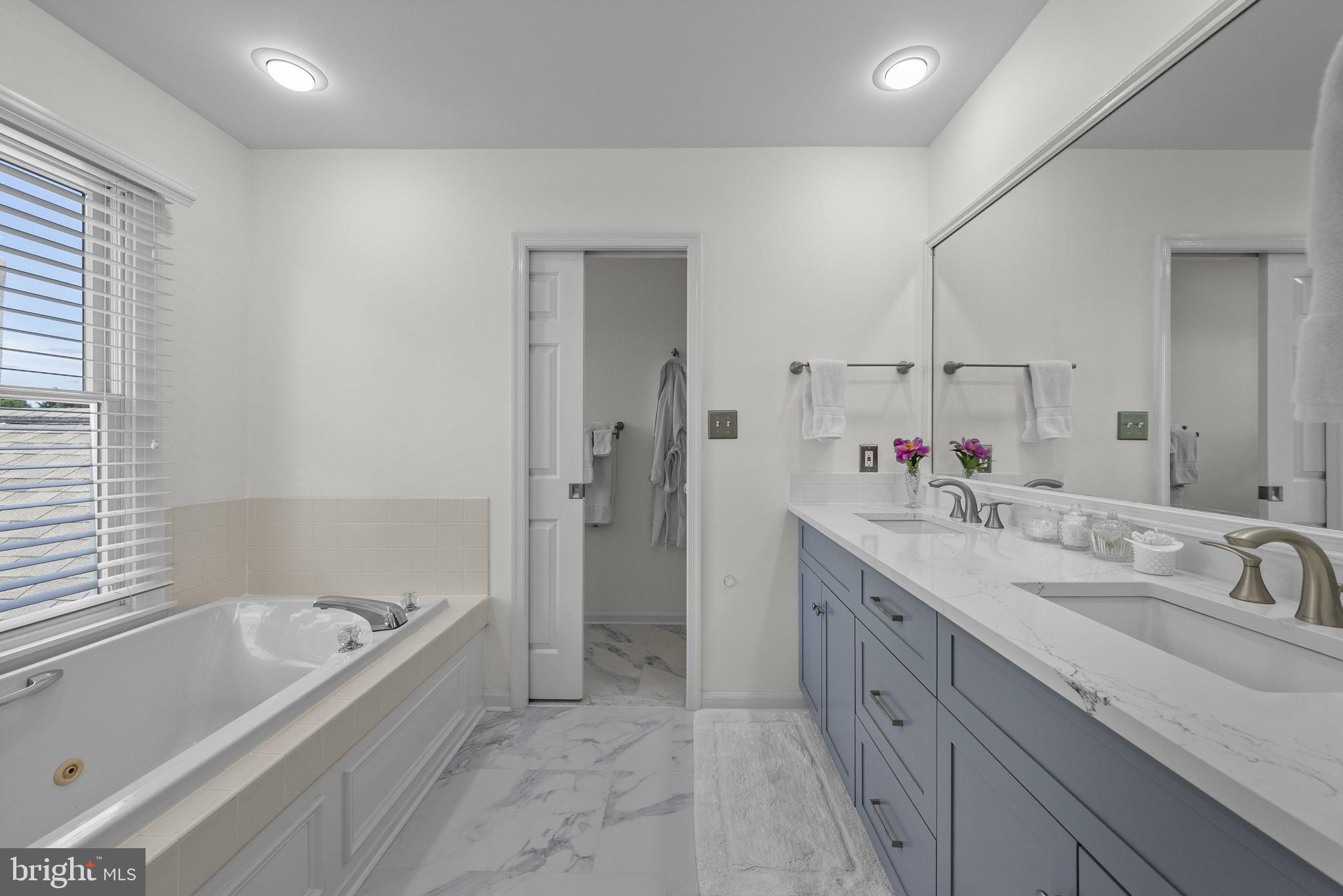 125 Mine Road Pennington, NJ 08534 - Photo 24 of 36 a spacious bathroom with a tub sink and mirror