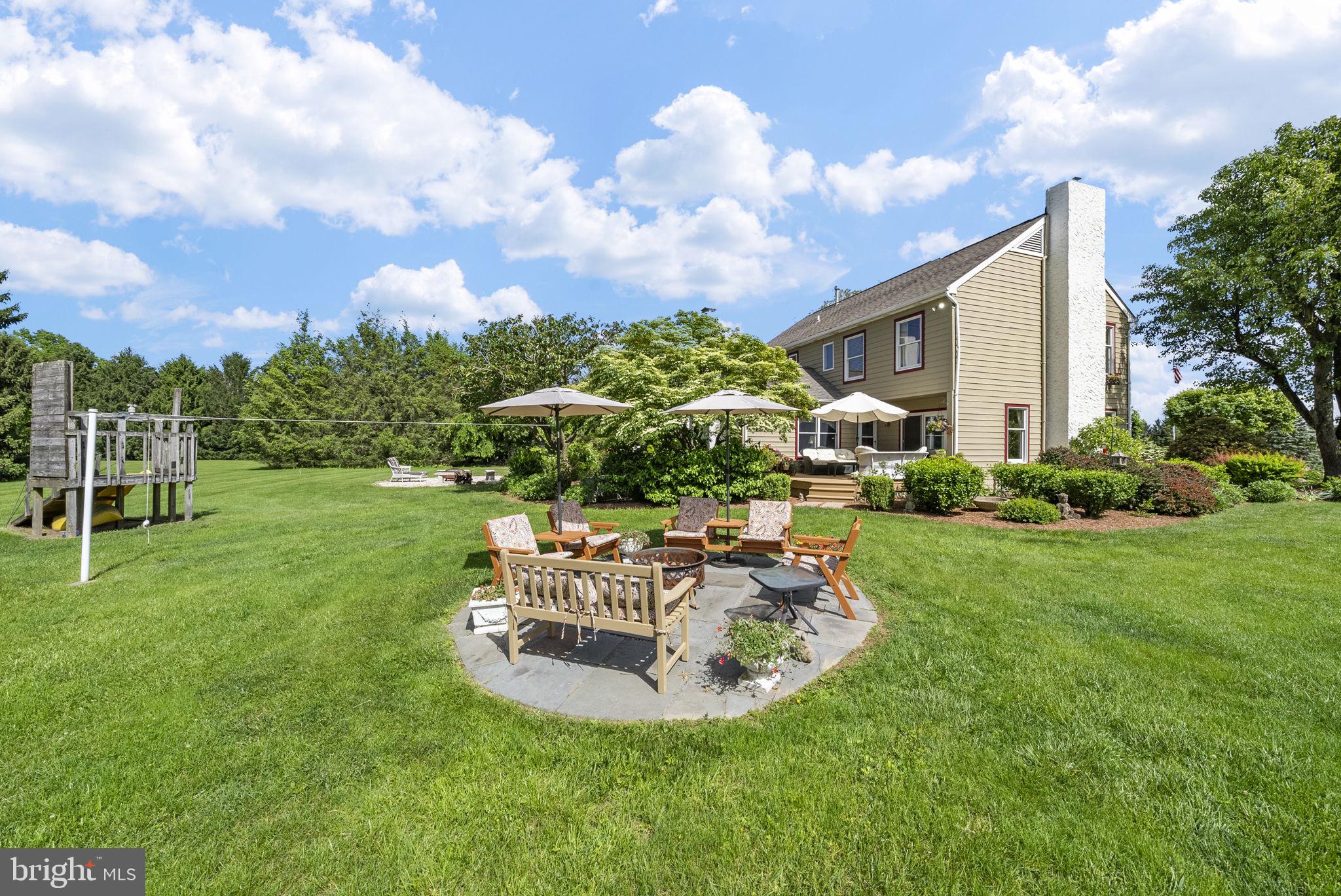 125 Mine Road Pennington, NJ 08534 - Photo 32 of 36 a view of a house with backyard porch and sitting area