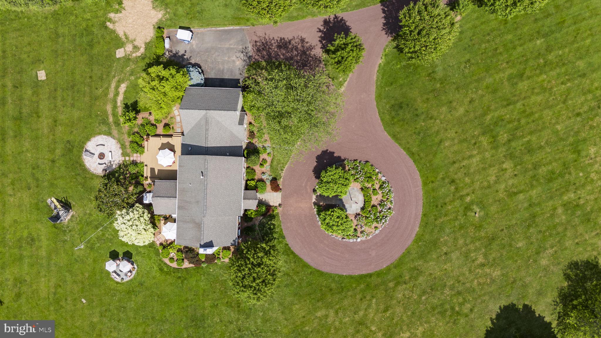 125 Mine Road Pennington, NJ 08534 - Photo 4 of 36 an aerial view of a house with garden space and swimming pool