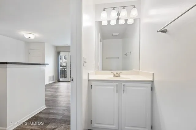 a bathroom with a sink and mirror