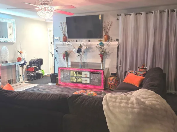 a bedroom with bed and a flat tv screen
