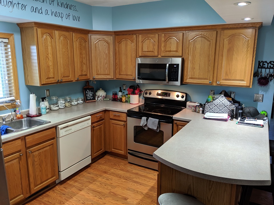 9660 Albany Road Erie, IL 61250 - Photo 22 of 33 a kitchen with stainless steel appliances a sink a stove a microwave a sink a refrigerator and cabinets