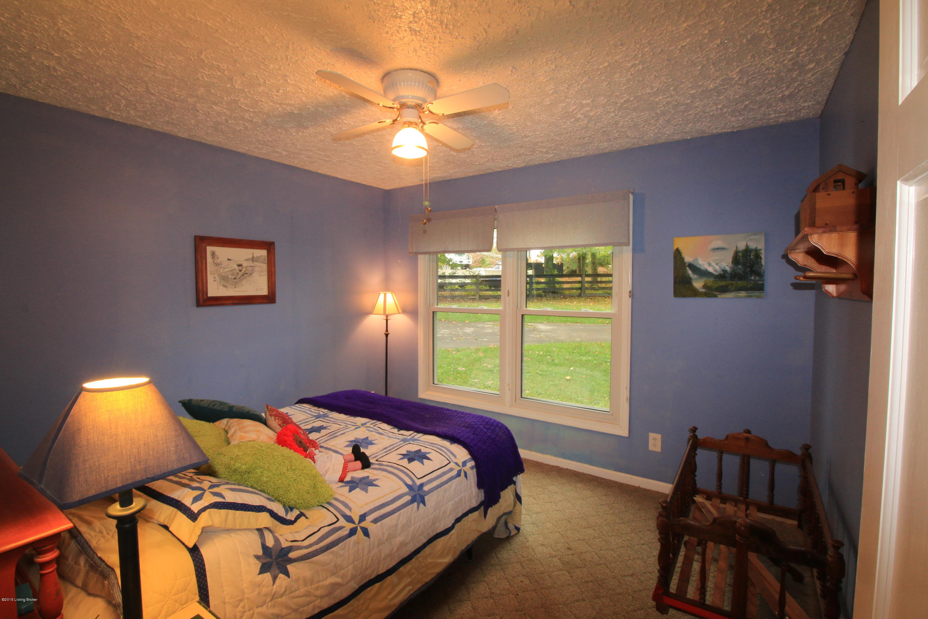 106 Callis Grove Pendleton, KY 40055 - Photo 27 of 36 The second bedroom features two large windows with a view of the side yard, a generous closet, and an overhead fan light combo.