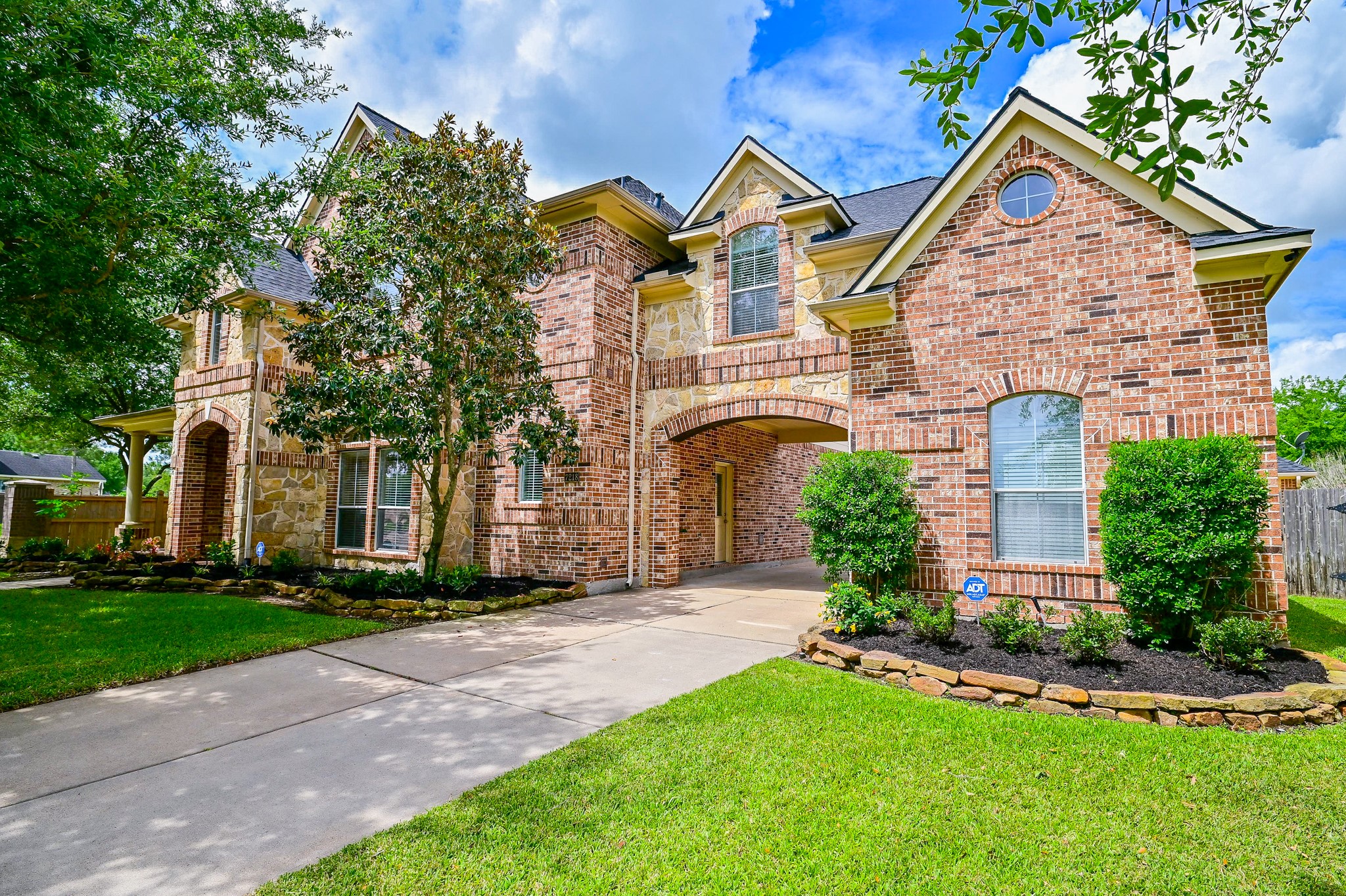 7218 Spring Run Lane Katy, TX 77494 - Photo 1 of 49 a front view of a house with a yard and trees