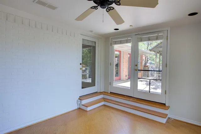 a spacious bedroom with a bed and a window