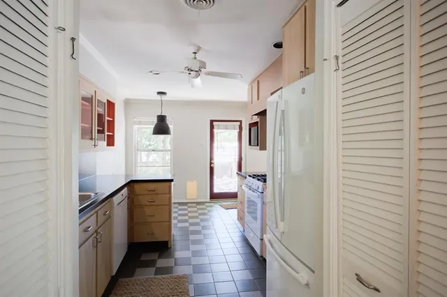 a hallway with cabinets