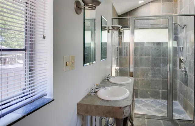 a bathroom with a sink and a mirror