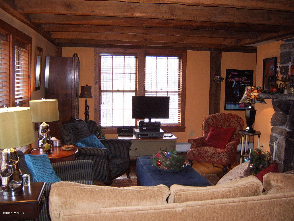 1191 George Carter Road Becket, MA 01223 - Photo 22 of 38 a living room with furniture and a flat screen tv