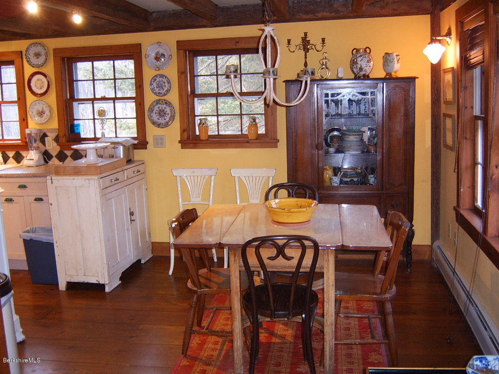 1191 George Carter Road Becket, MA 01223 - Photo 23 of 38 a view of a dining room with furniture window and wooden floor