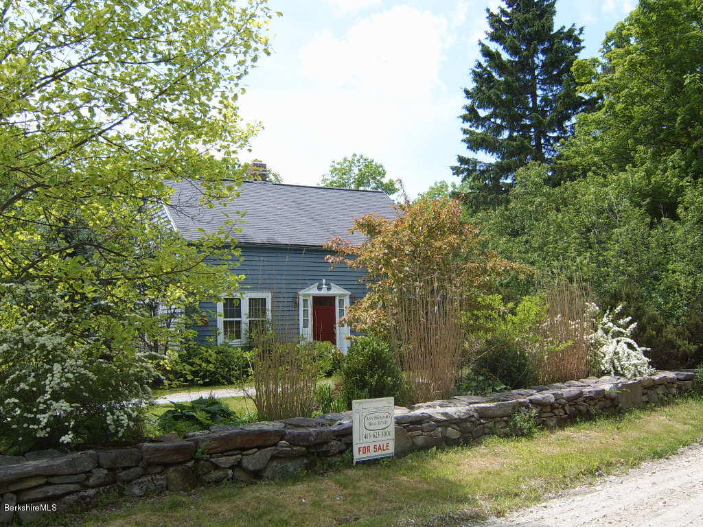 1191 George Carter Road Becket, MA 01223 - Photo 5 of 38 a house with a tree in front of it