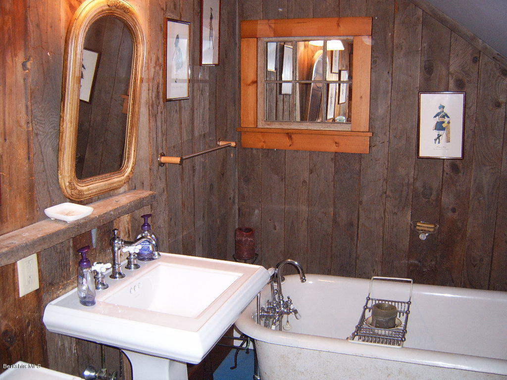 1191 George Carter Road Becket, MA 01223 - Photo 9 of 38 a bathroom with a sink and a mirror