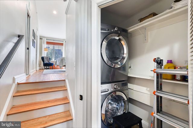 a view of livingroom with washer and dryer