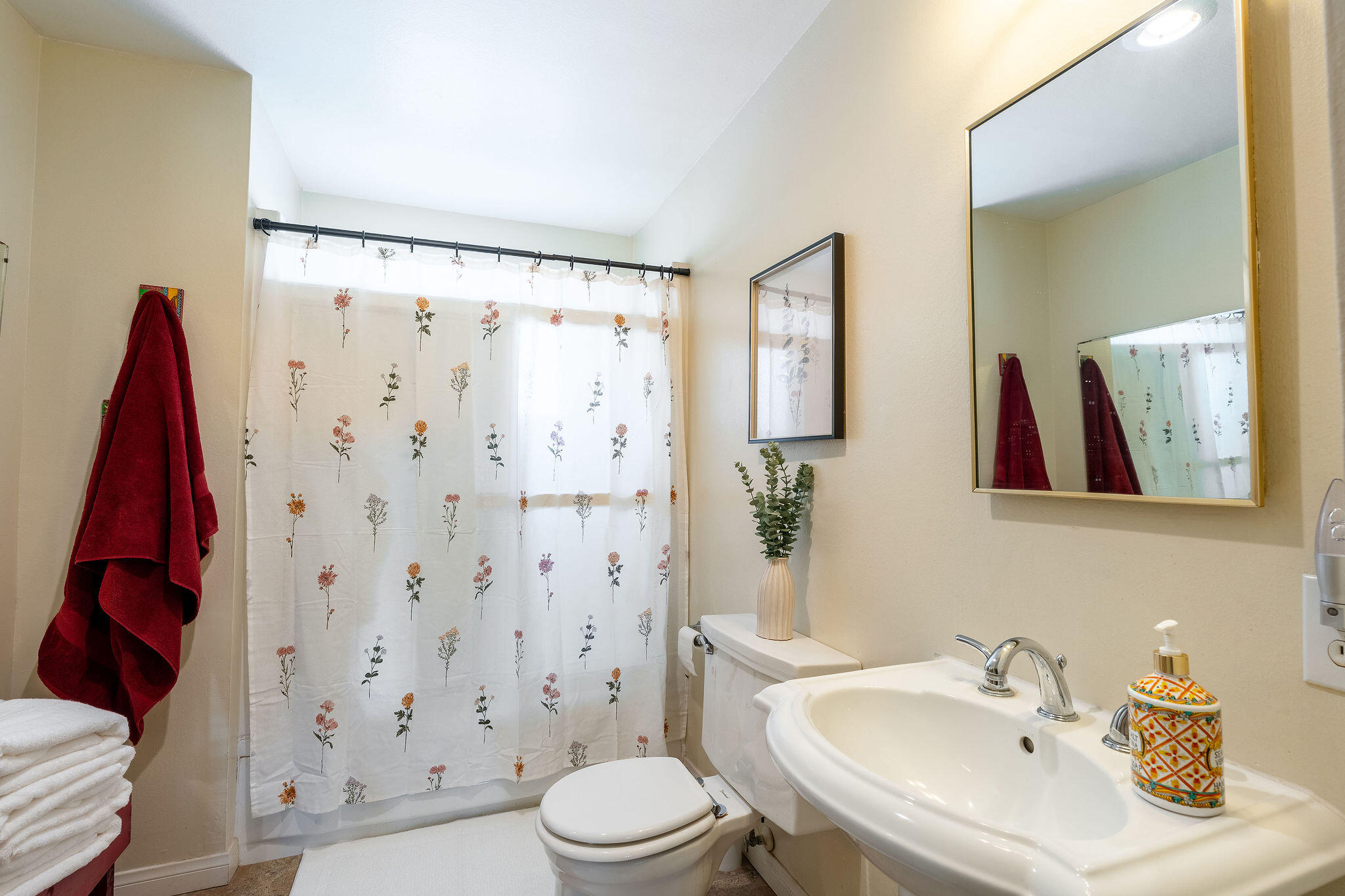 42735 Kansas Street Palm Desert, CA 92211 - Photo 26 of 48 a bathroom with a sink a toilet and shower curtain