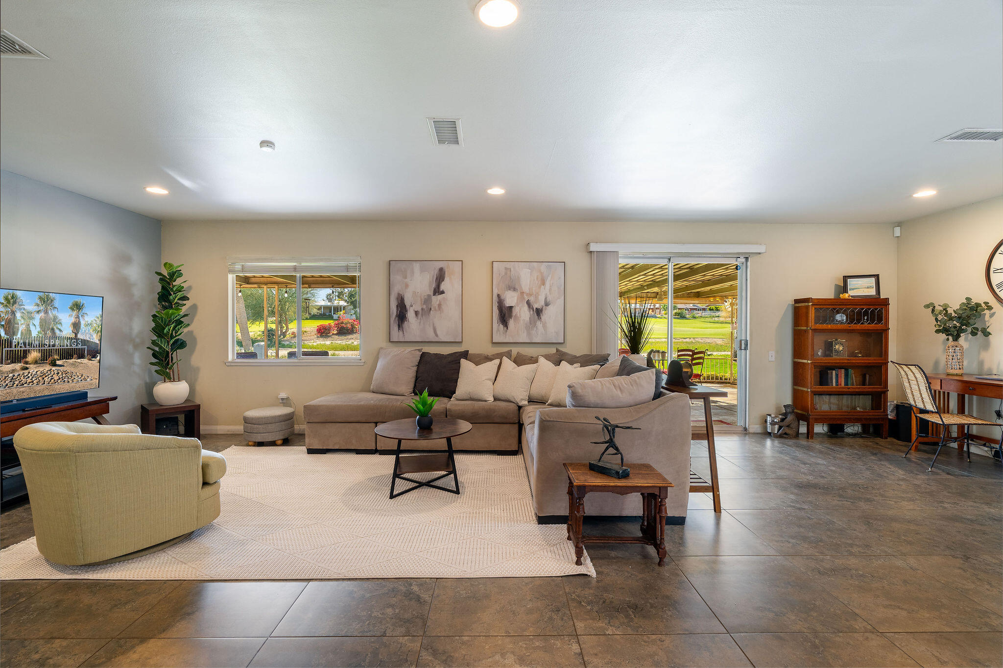 42735 Kansas Street Palm Desert, CA 92211 - Photo 3 of 48 a living room with furniture and a flat screen tv