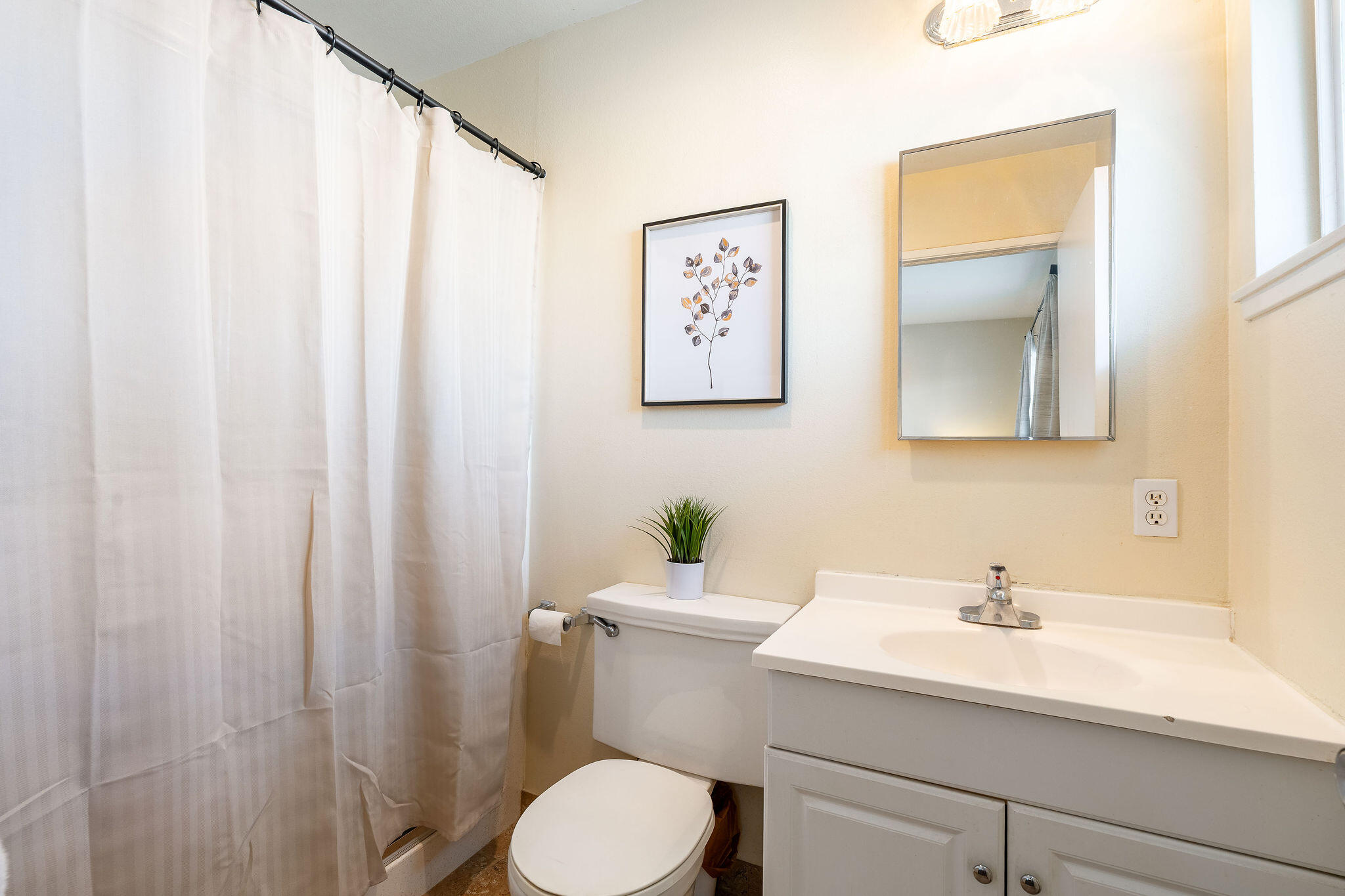 42735 Kansas Street Palm Desert, CA 92211 - Photo 31 of 48 a bathroom with a sink a toilet and mirror