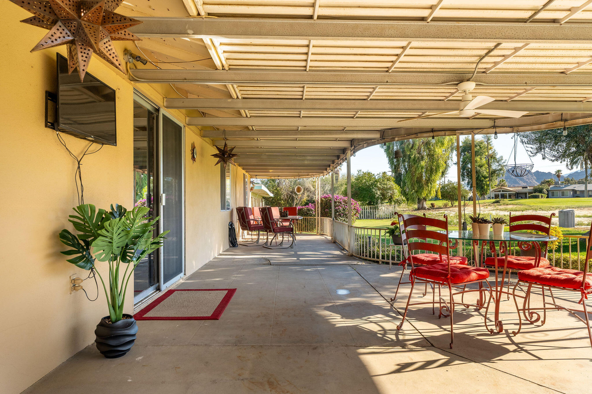 42735 Kansas Street Palm Desert, CA 92211 - Photo 34 of 48 a view of a tables and chairs in patio