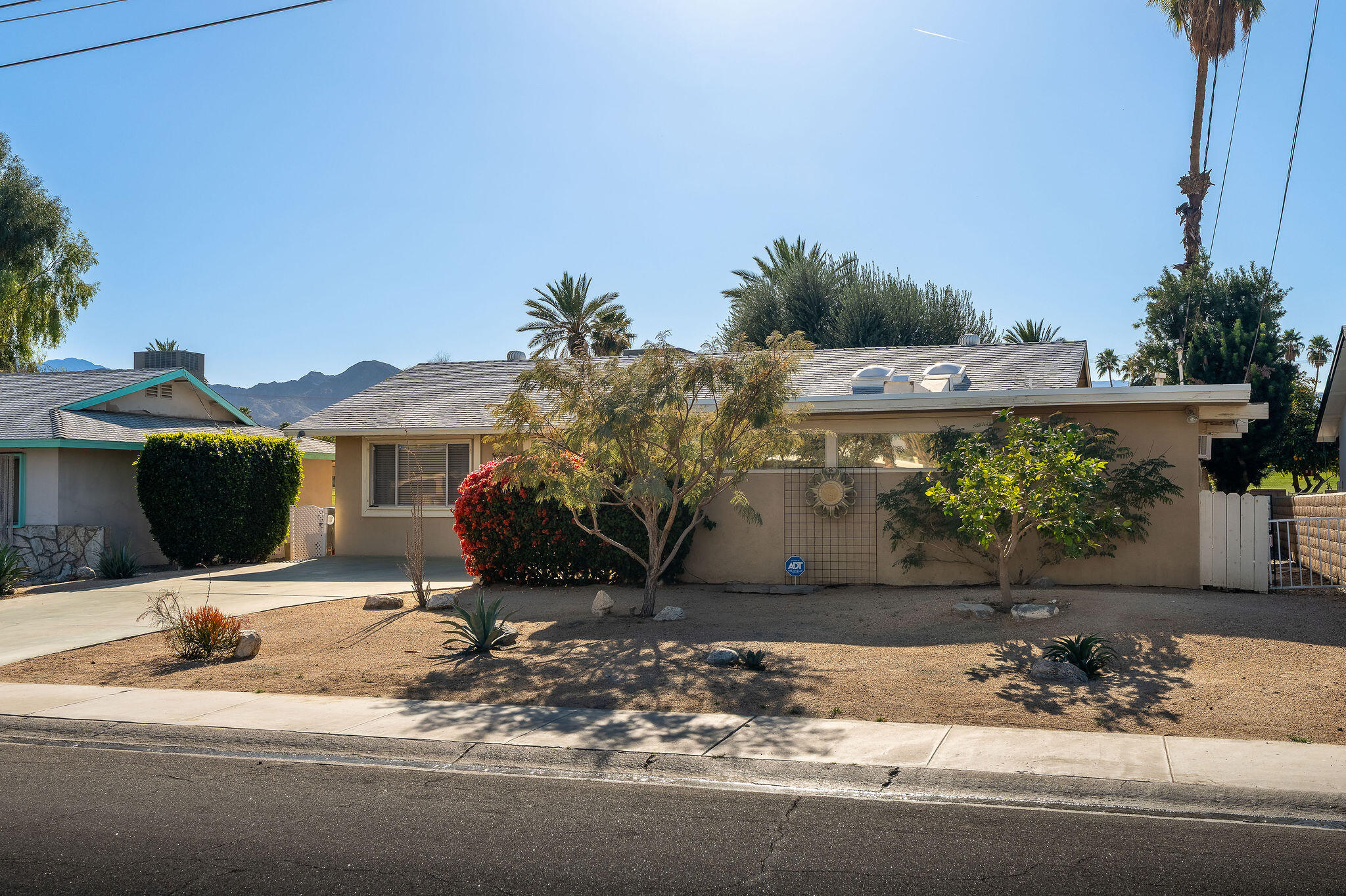 42735 Kansas Street Palm Desert, CA 92211 - Photo 8 of 48 a view of a house with a patio